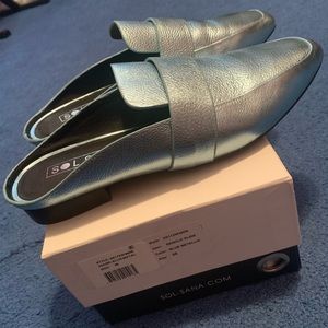 Beautiful blue metallic leather mules.